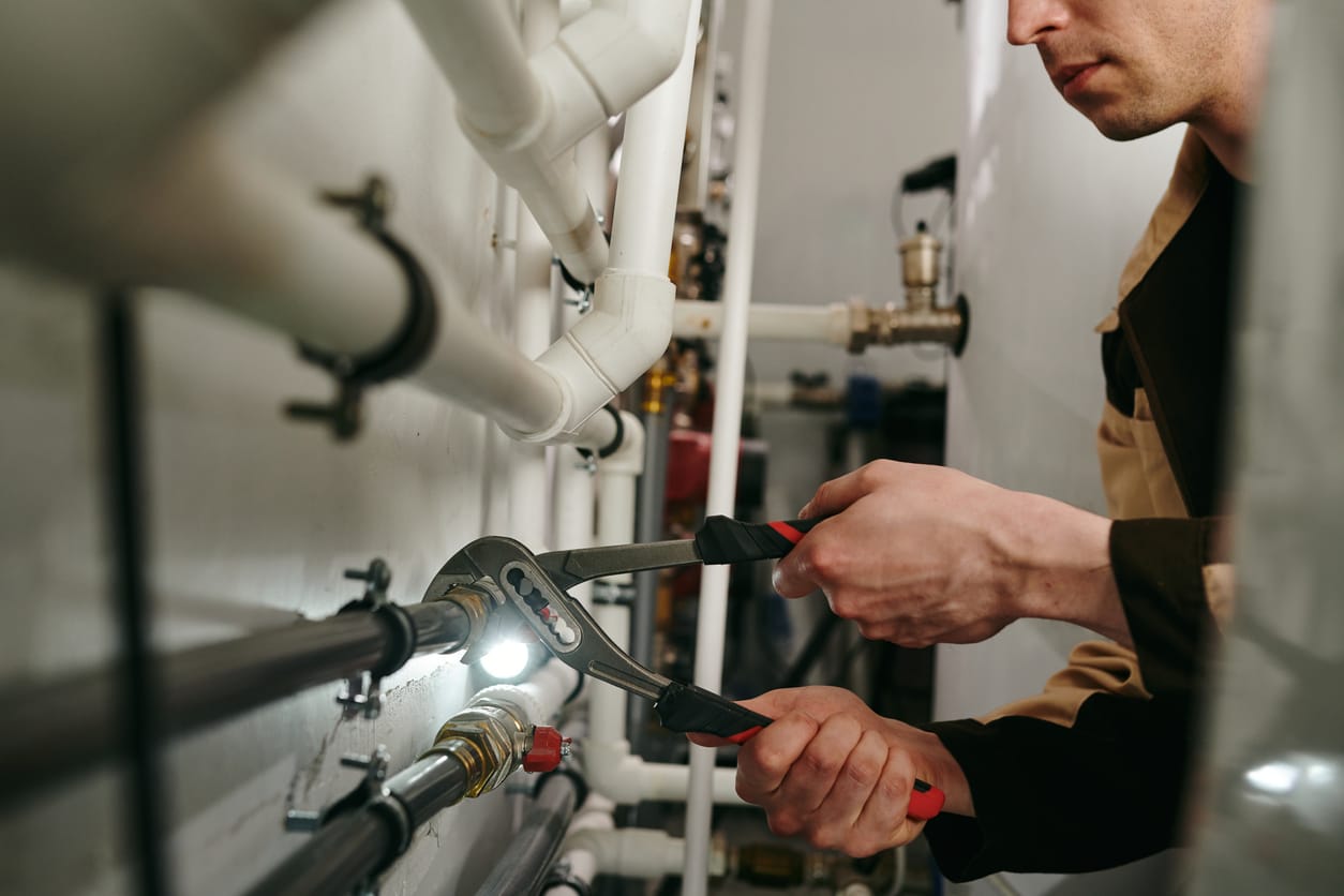 Plumbers maintaining commercial plumbing pipes in Pinellas Park