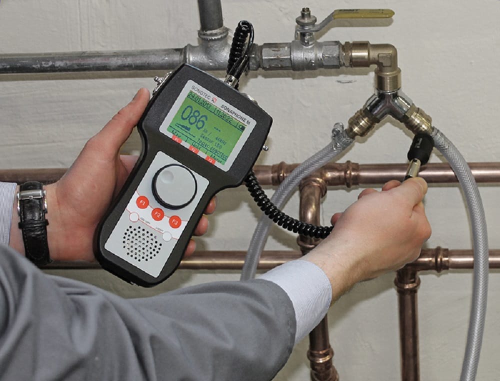 Plumber testing pipes with electronic leak detection equipment in Pinellas Park